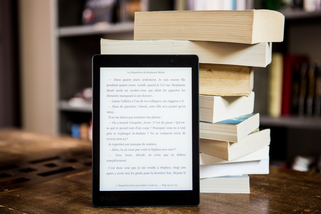 eBook is standing next to the traditional books