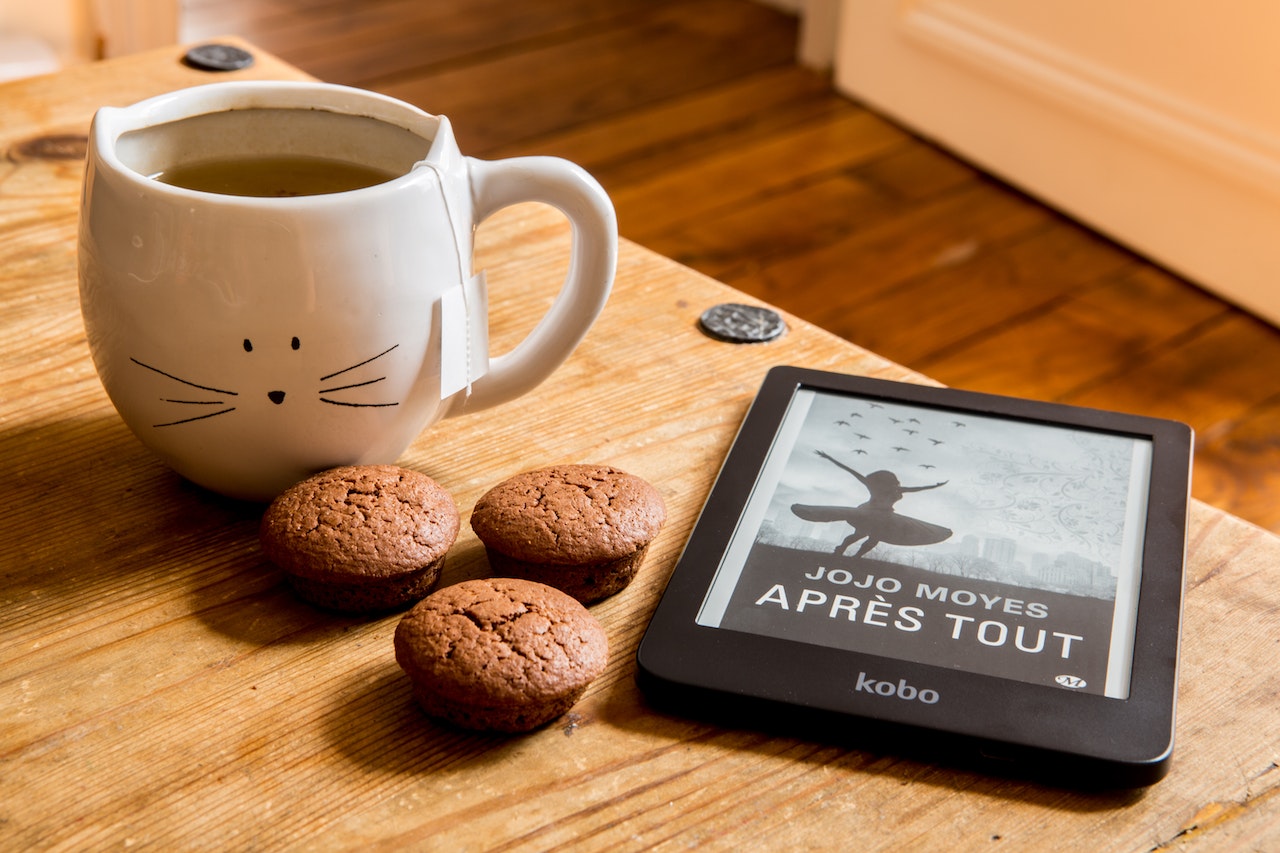 eBook, cookies and cup of hot chocolate on a desk