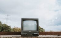 Old tv that is standing outside