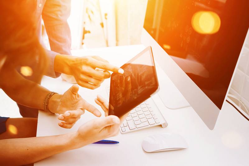 People choosing stock photos at marketing company